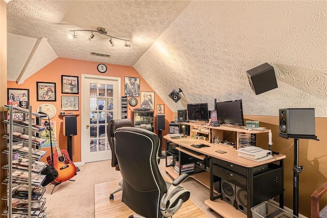 180 Moseley Crossing Dr, Stockbridge, GA 30281 - office area featuring a textured ceiling, lofted ceiling, and wood finished floors