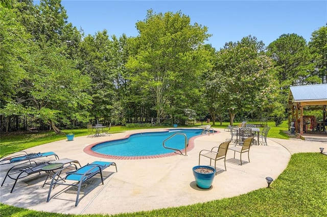180 Moseley Crossing Dr, Stockbridge, GA 30281 - outdoor pool featuring a patio and view of scattered trees