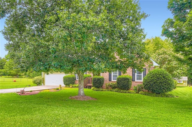 180 Moseley Crossing Dr, Stockbridge, GA 30281 - view of front of house featuring driveway, a front yard, and brick siding