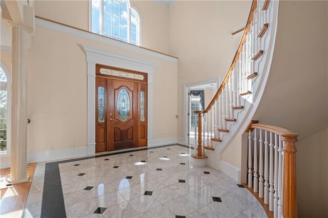 5414 Price Rd, Gainesville, GA 30506 - entrance foyer with crown molding, stairway, baseboards, and a towering ceiling