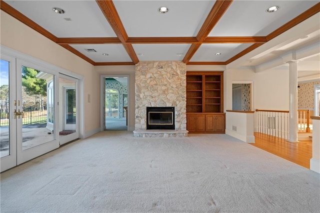 5414 Price Rd, Gainesville, GA 30506 - unfurnished living room with beam ceiling, a stone fireplace, coffered ceiling, and french doors