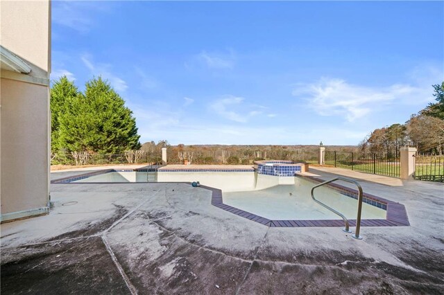 5414 Price Rd, Gainesville, GA 30506 - view of swimming pool featuring a pool with connected hot tub, a patio, and fence
