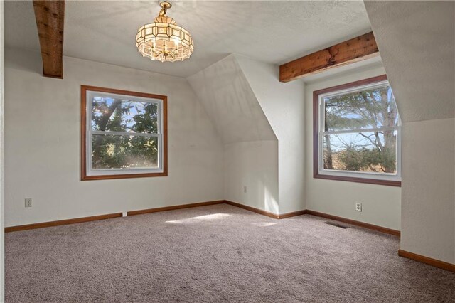 5414 Price Rd, Gainesville, GA 30506 - additional living space with visible vents, baseboards, a chandelier, carpet flooring, and a textured ceiling