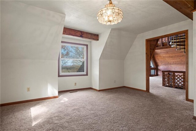 5414 Price Rd, Gainesville, GA 30506 - additional living space featuring baseboards, lofted ceiling, carpet, and an inviting chandelier