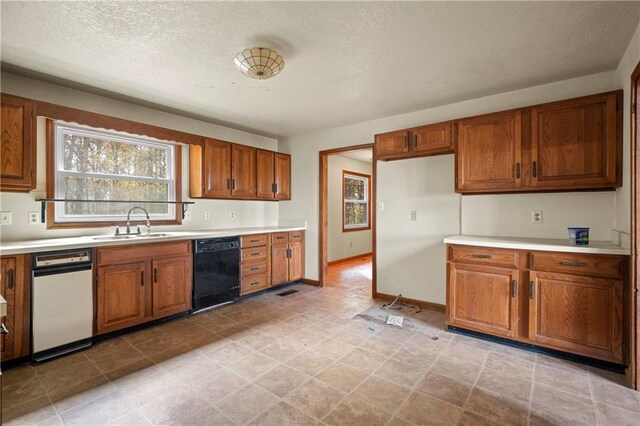 5414 Price Rd, Gainesville, GA 30506 - kitchen featuring brown cabinets, dishwasher, and light countertops