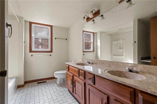 5414 Price Rd, Gainesville, GA 30506 - full bath with double vanity, toilet, baseboards, and a sink