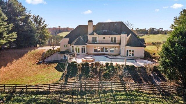 5414 Price Rd, Gainesville, GA 30506 - back of house featuring a fenced backyard, a balcony, an in ground hot tub, a chimney, and a patio area