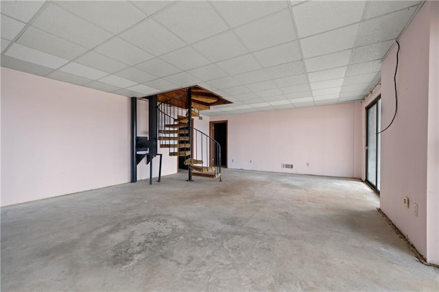 5414 Price Rd, Gainesville, GA 30506 - unfurnished living room with unfinished concrete flooring, stairs, and a paneled ceiling