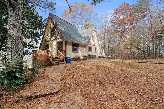 5414 Price Rd, Gainesville, GA 30506 - view of side of home with roof with shingles and a wooden deck