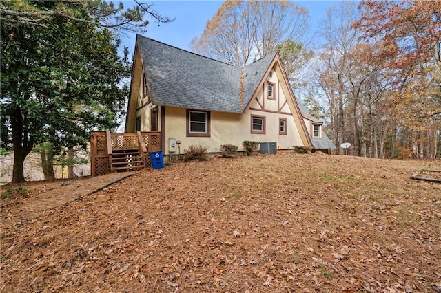 5414 Price Rd, Gainesville, GA 30506 - view of side of home with stucco siding, roof with shingles, and a wooden deck