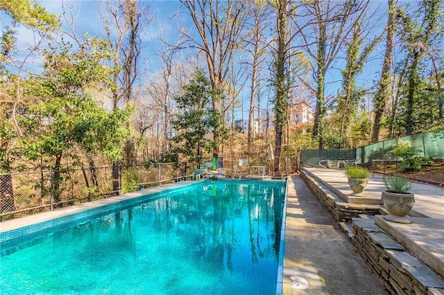 view of pool with fence and a fenced in pool