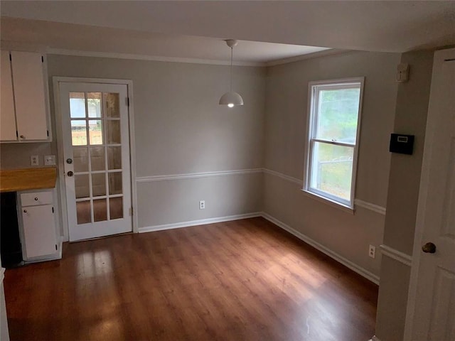 4347 Barrington Pl, Macon, GA 31210 - unfurnished dining area featuring wood finished floors, healthy amount of natural light, baseboards, and ornamental molding
