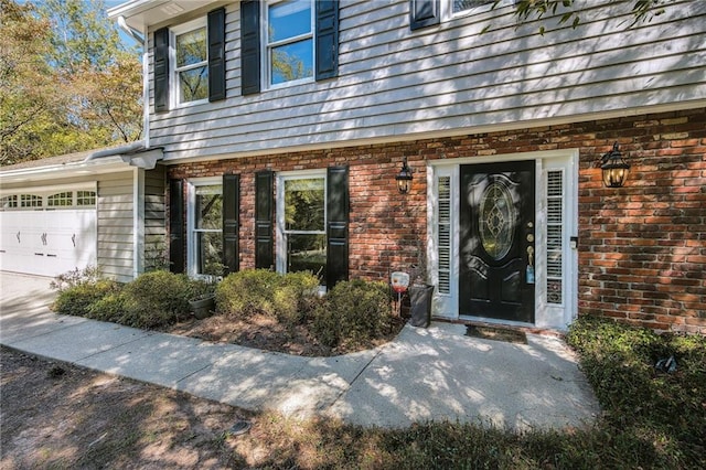 property entrance with a garage