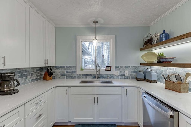 kitchen with white cabinetry, sink, pendant lighting, and dishwasher