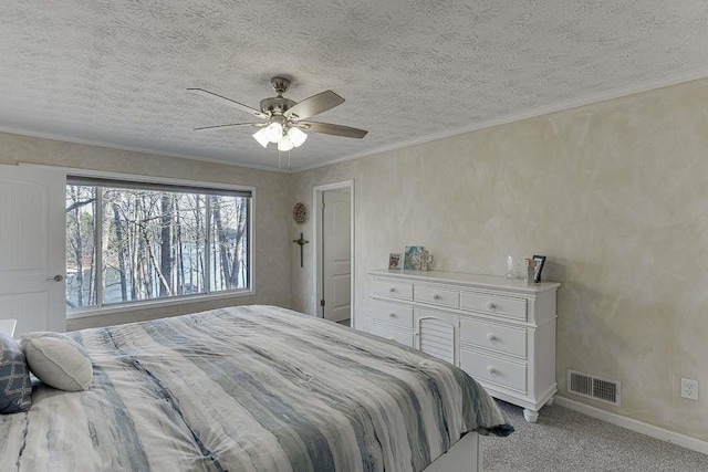 bedroom featuring ceiling fan, light colored carpet, ornamental molding, and a textured ceiling