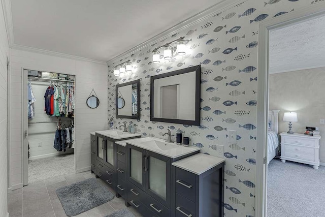 bathroom with crown molding and vanity