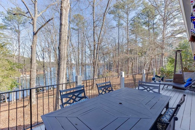 wooden terrace featuring a water view