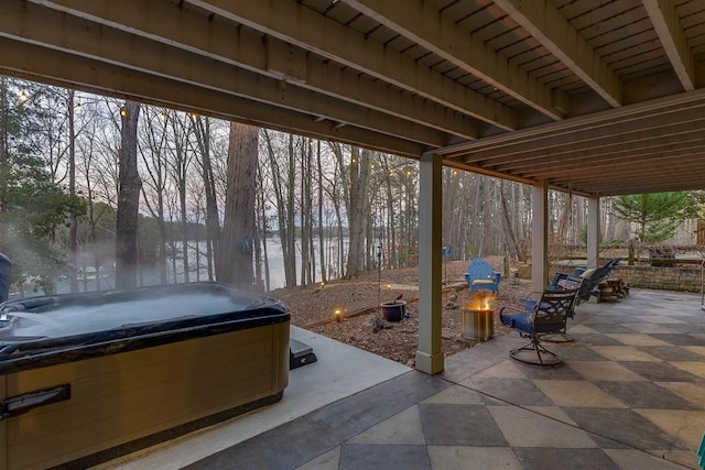 view of patio / terrace with a hot tub