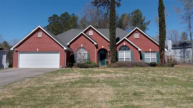 view of front property with a front yard and a garage