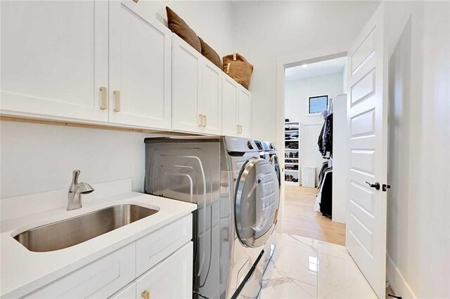 1455 Rucker Cir, Woodstock, GA 30188 - laundry room with independent washer and dryer, marble finish floor, a sink, and cabinet space