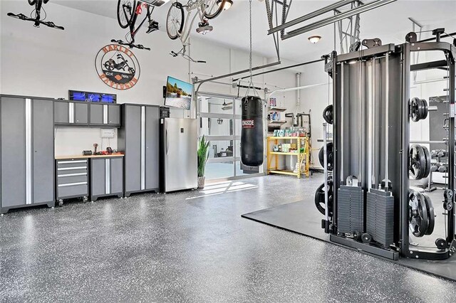 1455 Rucker Cir, Woodstock, GA 30188 - garage with freestanding refrigerator