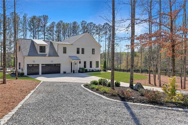 1455 Rucker Cir, Woodstock, GA 30188 - view of front facade with fence, a front yard, and curved driveway