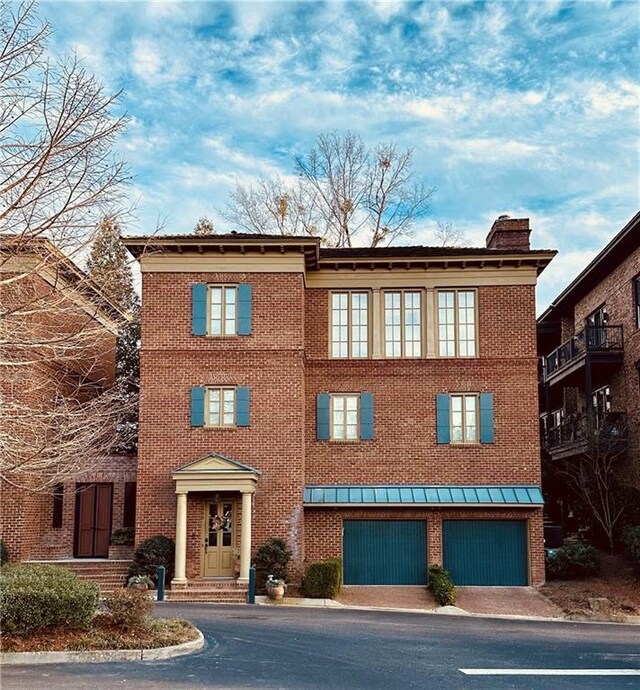 rear view of property with a balcony