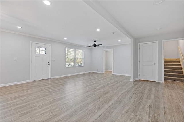 unfurnished living room with ornamental molding, ceiling fan, and light wood-type flooring