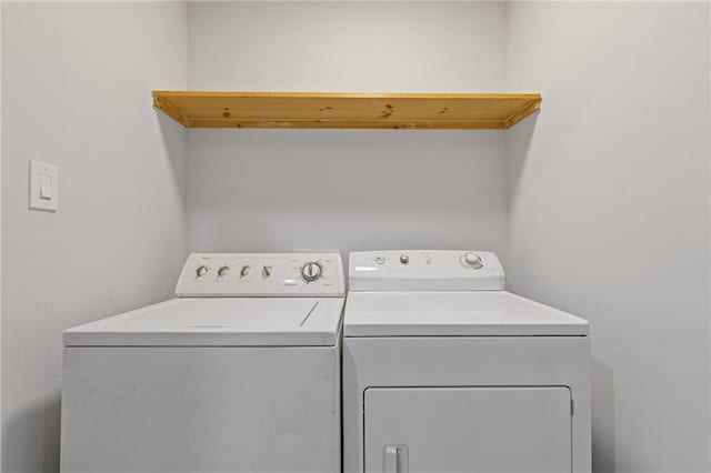 laundry room featuring separate washer and dryer