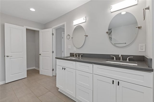 bathroom with vanity and tile patterned floors