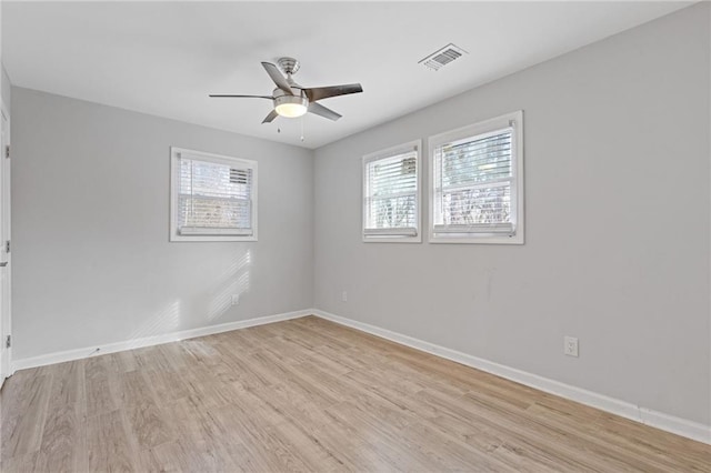 1974 Browns Mill Rd SE, Atlanta, GA 30315 - empty room with a ceiling fan, light wood-style floors, and baseboards