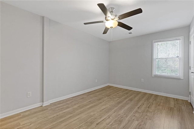 spare room with light hardwood / wood-style flooring and ceiling fan