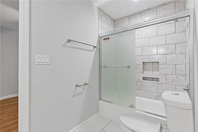 1974 Browns Mill Rd SE, Atlanta, GA 30315 - full bathroom featuring toilet, enclosed tub / shower combo, and baseboards