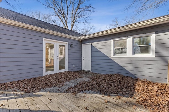 property entrance featuring a deck and french doors