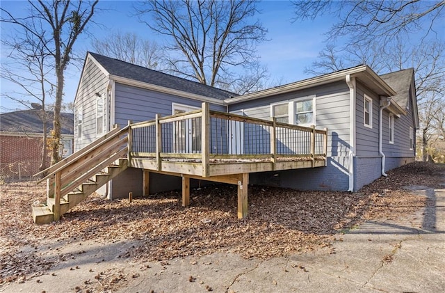 back of house with a wooden deck