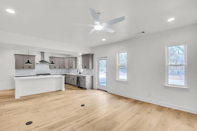 474 Maxwell Rd, Roswell, GA 30075 - kitchen featuring wall chimney range hood, appliances with stainless steel finishes, light countertops, healthy amount of natural light, and recessed lighting