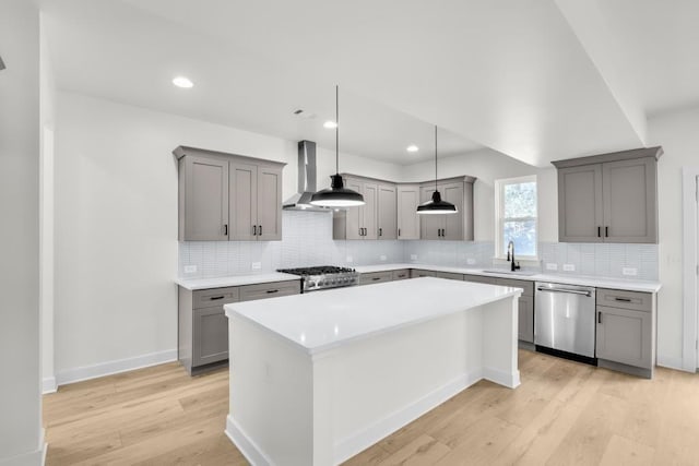 474 Maxwell Rd, Roswell, GA 30075 - kitchen featuring stainless steel dishwasher, gray cabinetry, wall chimney exhaust hood, light wood-style floors, and a center island