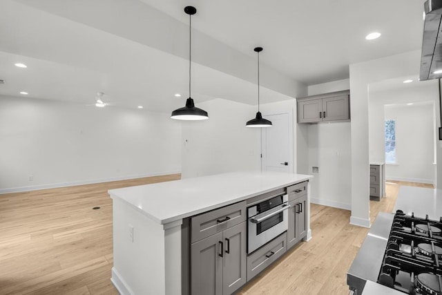 474 Maxwell Rd, Roswell, GA 30075 - kitchen with gray cabinetry, oven, light wood-style floors, pendant lighting, and recessed lighting