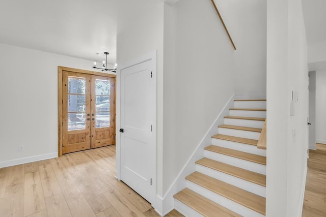 474 Maxwell Rd, Roswell, GA 30075 - entryway featuring a chandelier, stairs, light wood-style flooring, and french doors
