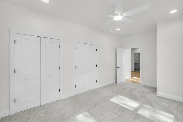 474 Maxwell Rd, Roswell, GA 30075 - unfurnished bedroom with two closets, light colored carpet, recessed lighting, and ceiling fan