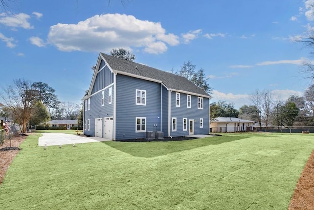 474 Maxwell Rd, Roswell, GA 30075 - back of house featuring a garage, concrete driveway, and roof with shingles