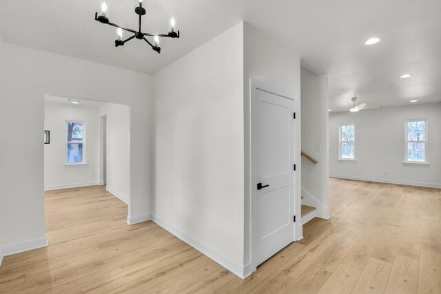 474 Maxwell Rd, Roswell, GA 30075 - spare room with a chandelier, light wood-type flooring, stairway, recessed lighting, and a ceiling fan