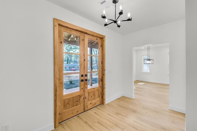 474 Maxwell Rd, Roswell, GA 30075 - entryway with a chandelier, french doors, and light wood-type flooring
