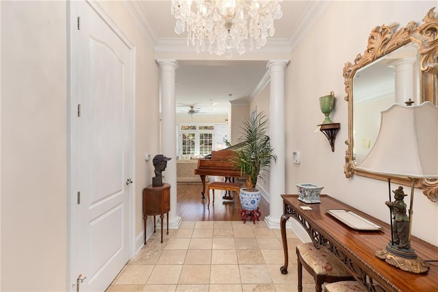 hallway with ornate columns, ornamental molding, baseboards, and light tile patterned flooring