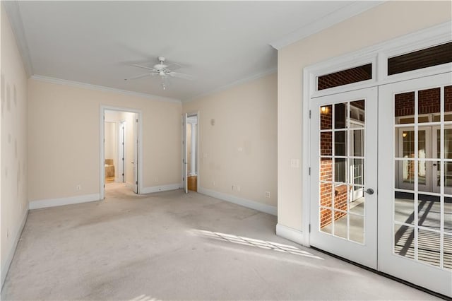 empty room featuring ornamental molding, a ceiling fan, baseboards, and carpet flooring