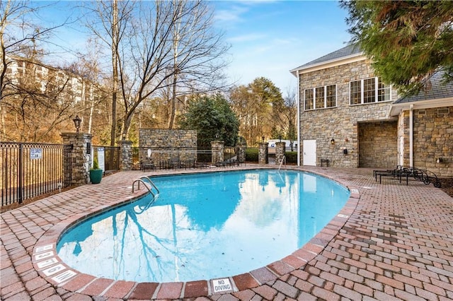 view of swimming pool with a patio