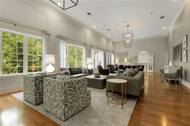 lobby with ornamental molding and recessed lighting