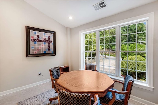 dining area with baseboards, vaulted ceiling, light tile patterned flooring, an office area, and recessed lighting