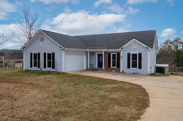 ranch-style home with a garage and a front lawn