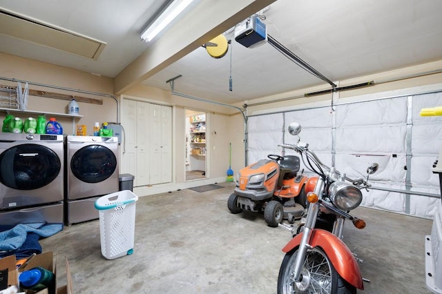 garage with a garage door opener and washer and dryer